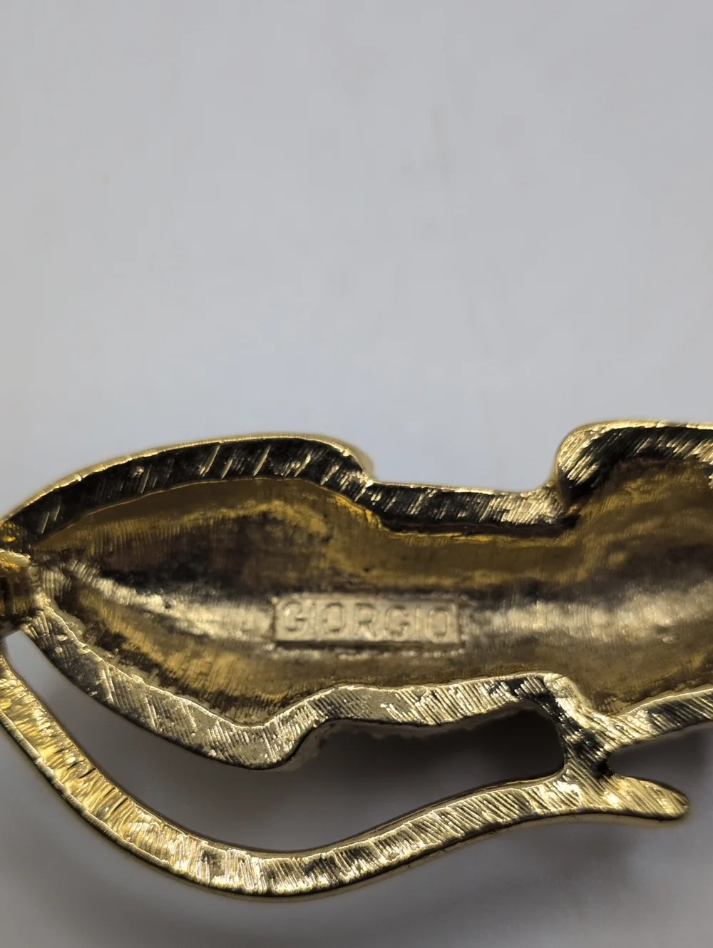 Giorgio Gold-Tone Leopard Brooch with Green and Black Stones